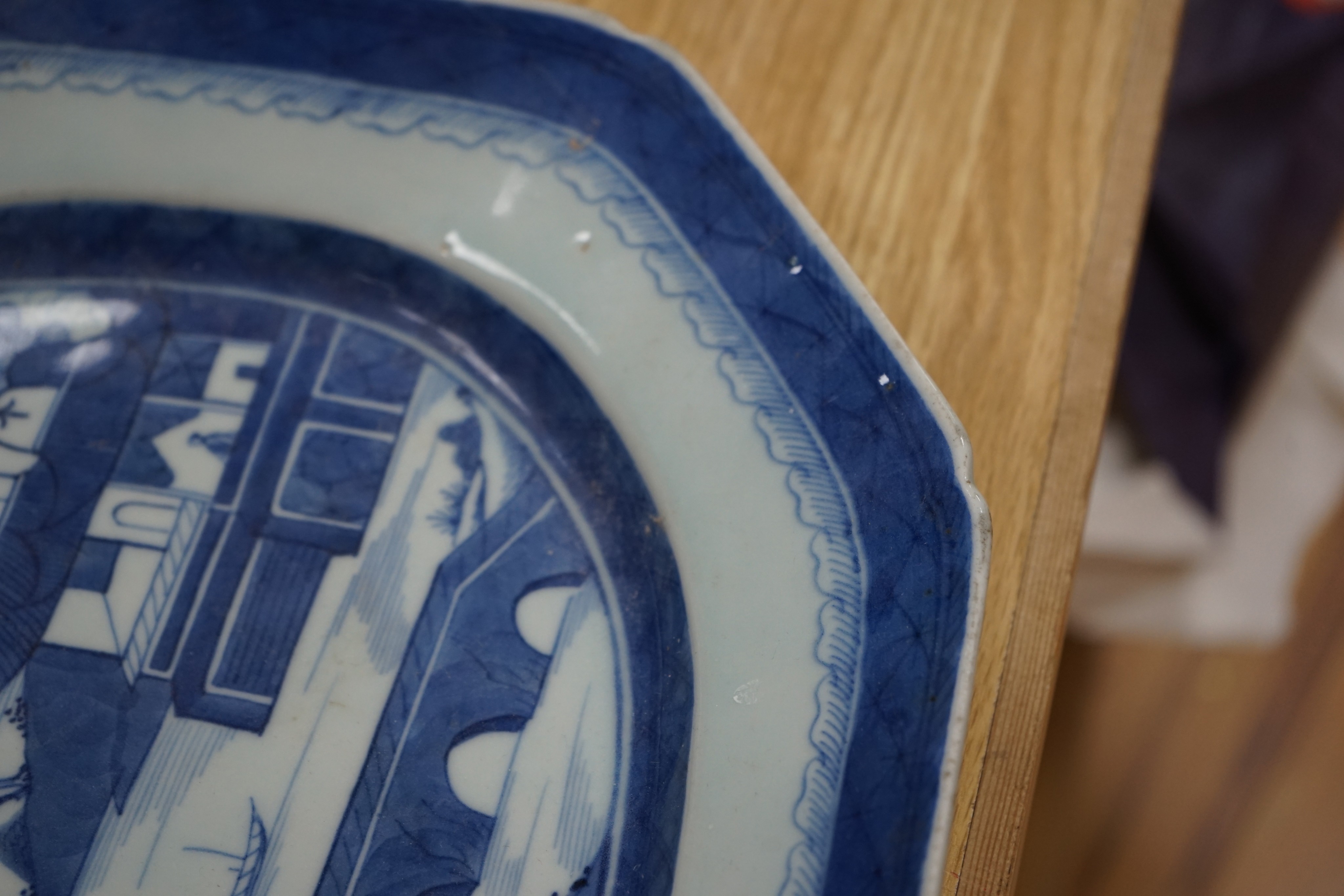 A 19th century Chinese Export blue and white octagonal meat dish, decorated with a lake scene, W 42cm